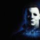 Official Halloween: The Game key art of Michael Myers over a Haddonfield street