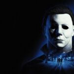 Official Halloween: The Game key art of Michael Myers looming over Haddonfield